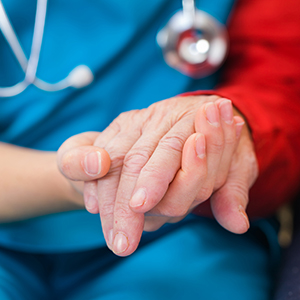 Doctor holding patient's hand